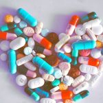 A compiled bunch of pills shaped into a heart, because art.